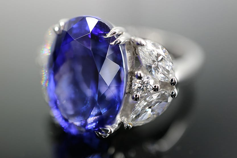 Luxury tanzanite and diamond ring handcrafted by The Diamond Works featuring a vivid violet-blue tanzanite gemstone.