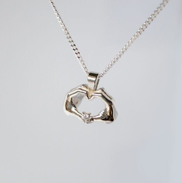 UBUNTU pendant with natural white petite diamond set in sterling silver with chain